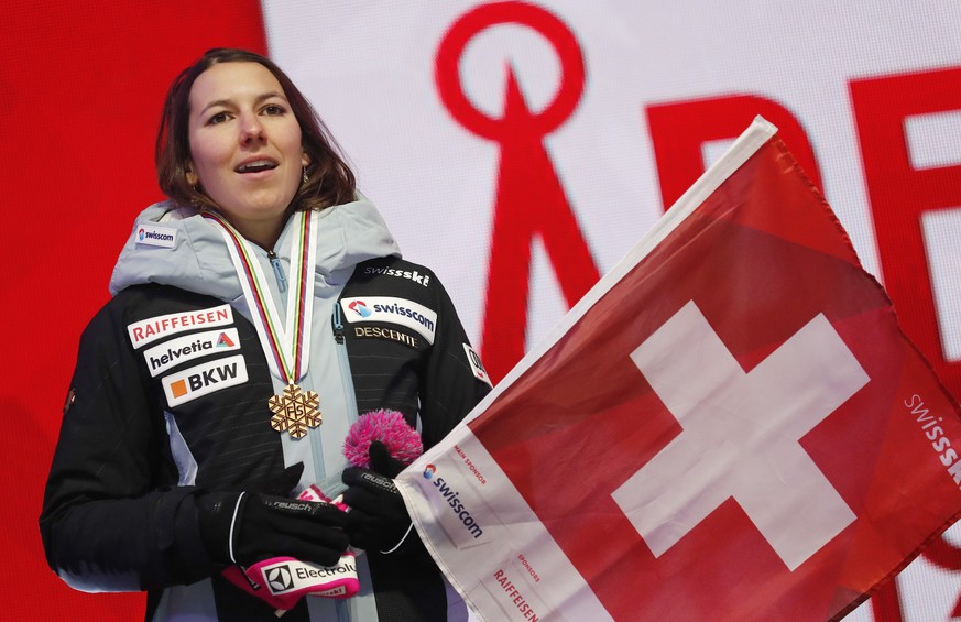 Switzerland&#039;s Wendy Holdener waves her national flag during the medal ceremony for the women&#039;s combined race, at the alpine ski World Championships in Are, Sweden, Friday, Feb. 8, 2019. (AP  ...