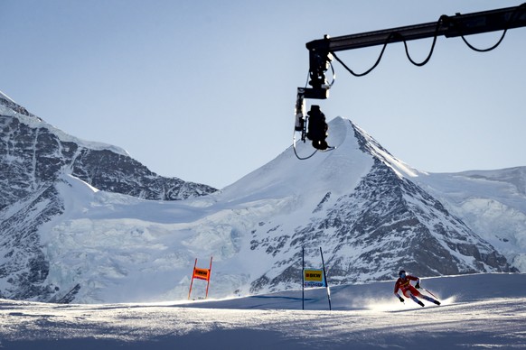 Marco Odermatt of Switzerland in action in front of a Louma camera of the Swiss Broadcasting SRG responsible for the TV production during the men&#039;s Super G race at the Alpine Skiing FIS Ski World ...