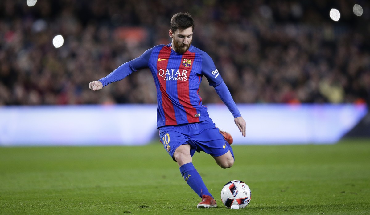 FC Barcelona's Lionel Messi kicks the ball to scores during a Copa del Rey, 16 round, second leg, between FC Barcelona and Athletic Bilbao at the Camp Nou in Barcelona, Spain, Wednesday, Jan. 11, ...