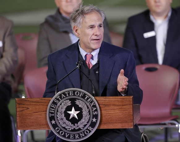 Texas Gov. Greg Abbott speaks during a prayer vigil for the victims of the Sutherland Springs First Baptist Church shooting Wednesday, Nov. 8, 2017, in Floresville, Texas. A man opened fire inside the ...