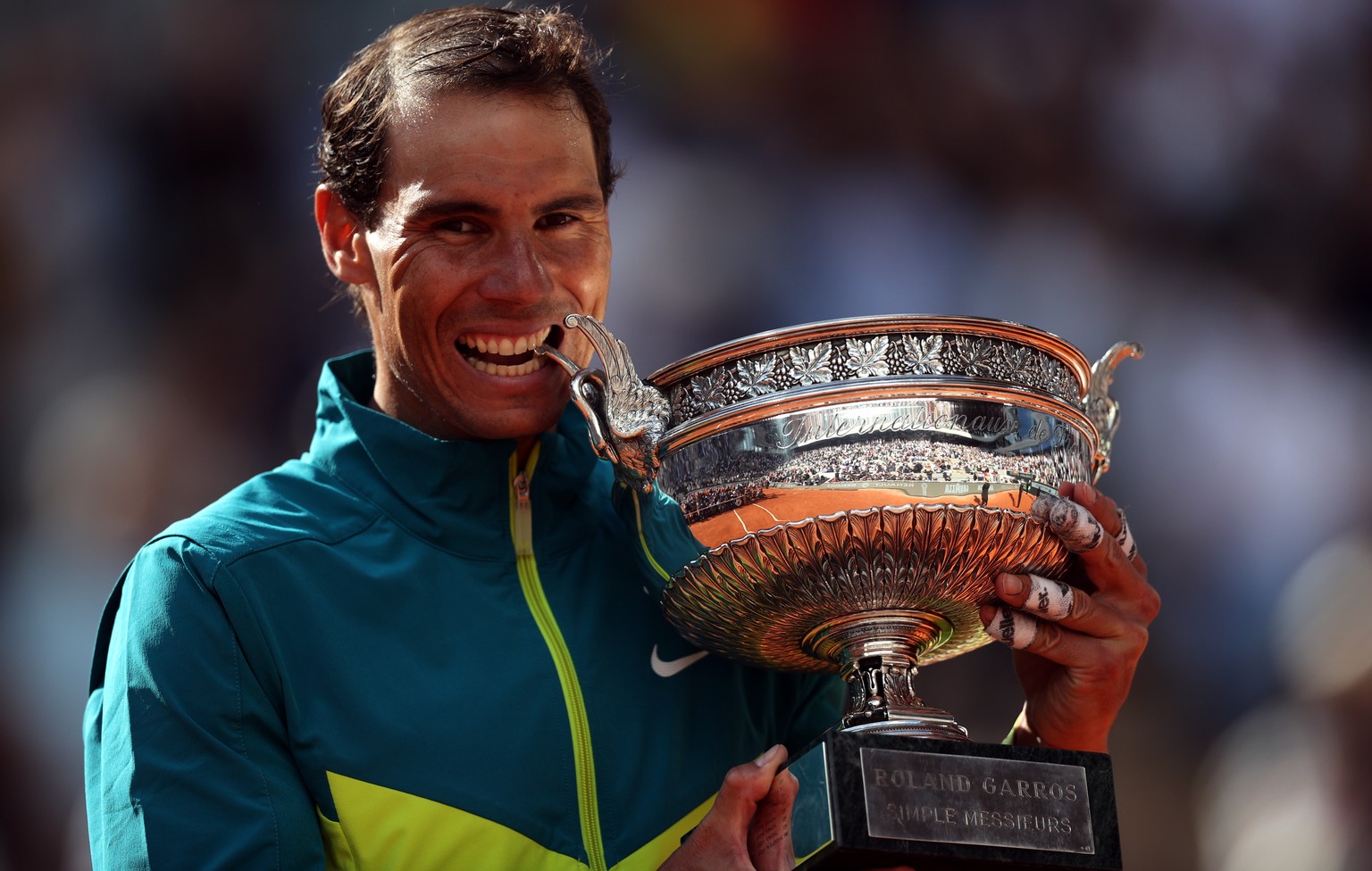 epa09997553 Rafael Nadal of Spain celebrates with the trophy La Coupe des Mousquetaires after winning against Casper Ruud of Norway in their Men?s Singles final match during the French Open tennis tou ...