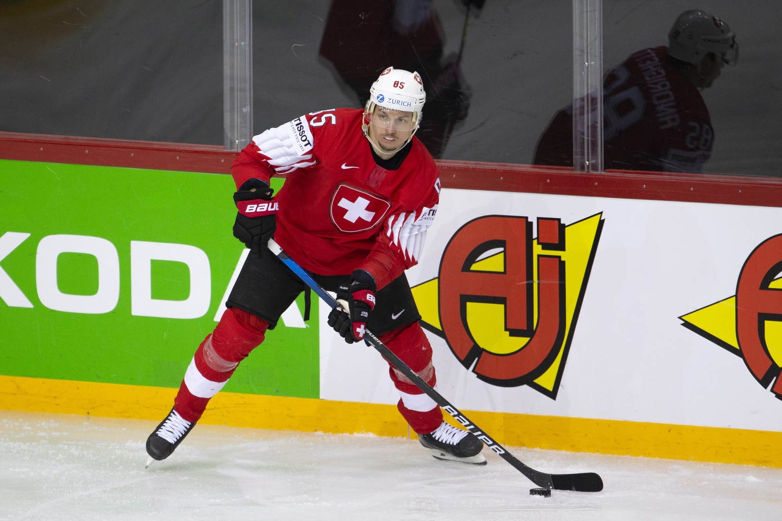 Switzerland&#039;s forward Sven Andrighetto controls the puck, during the IIHF 2021 World Championship preliminary round game between Switzerland and Great Britain, at the Olympic Sports Center, in Ri ...