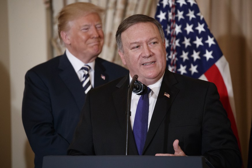 epa06707139 US Secretary of State Mike Pompeo (R), with US President Donald J. Trump (R), delivers remarks during a ceremonial swearing in ceremony at the State Department in Washington, DC, USA, 02 M ...