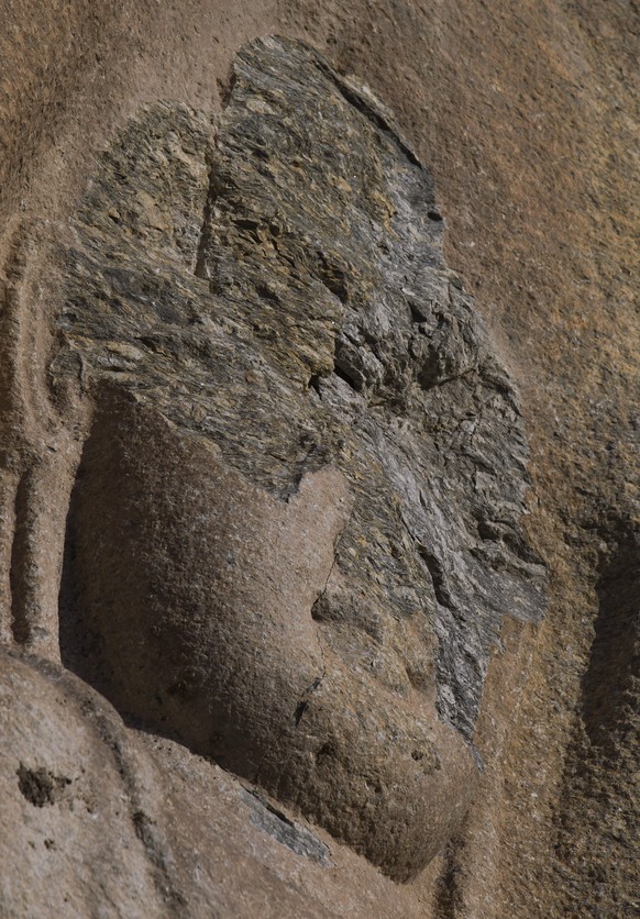 FILE - This May 24, 2012 file photo, shows the face of a sculpture of the Buddha which was destroyed by Taliban fighters at Jahanabad, Pakistan in the Swat valley. Throughout the centuries, invaders,  ...