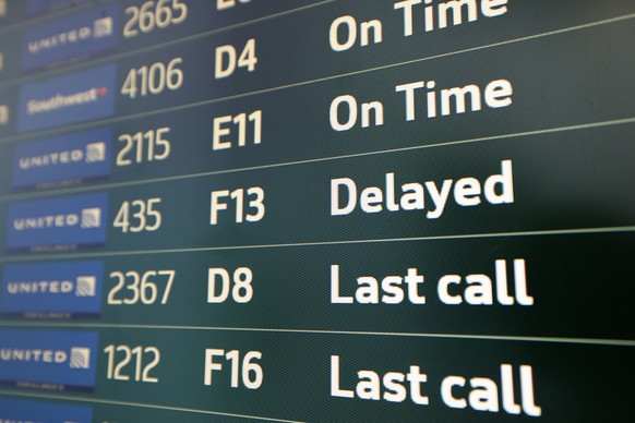 epa12526632 A United flight delayed shown on the departures board at the San Francisco International Airport (SFO) in San Francisco, California, USA, 14 November 2025. Officials warned it may take day ...
