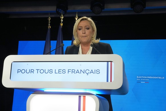 Far-right leader Marine Le Pen speaks after the early result projections of the French presidential election runoff were announced in Paris, Sunday, April 24, 2022. French polling agencies are project ...