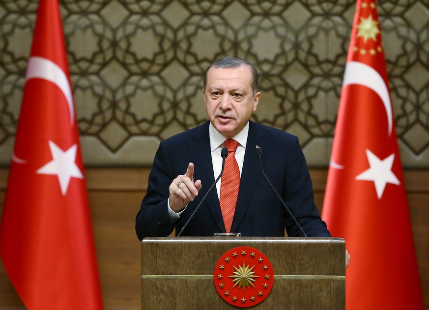 epa05697646 A handout photo made available by the Turkish President Press office shows, Turkish President Recep Tayyip Erdogan speaking during 33rd mukhtars (local officials) meeting in Ankara, Turkey ...