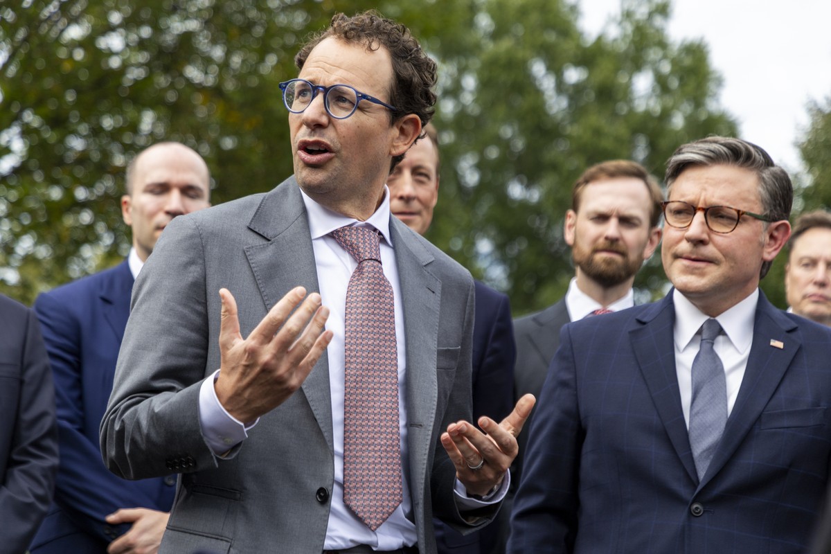 epa13271719 Speaker of the House Mike Johnson (R) listens as CEO and co-founder of Anthropic Dario Amodei (L) responds to a question from the news media outside the West Wing of the White House in Was ...