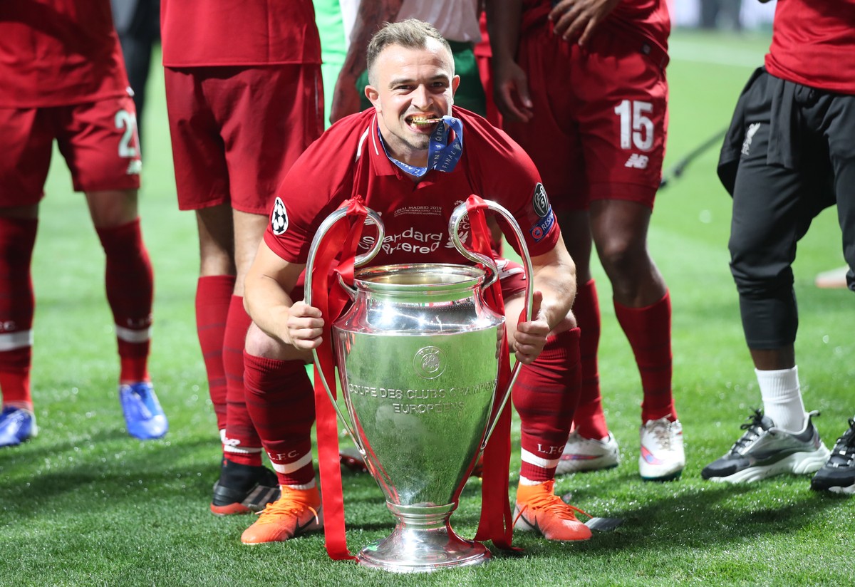epa07619119 Liverpool's Xherdan Shaqiri lifts the trophy after winning the UEFA Champions League final between Tottenham Hotspur and Liverpool FC at the Wanda Metropolitano stadium in Madrid, Spa ...