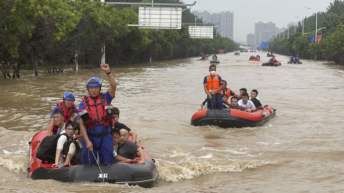 Residents are evacuated by rubber boats through flood waters in Zhuozhou in northern China's Hebei province, south of Beijing, Wednesday, Aug. 2, 2023. China's capital has recorded its heavi ...