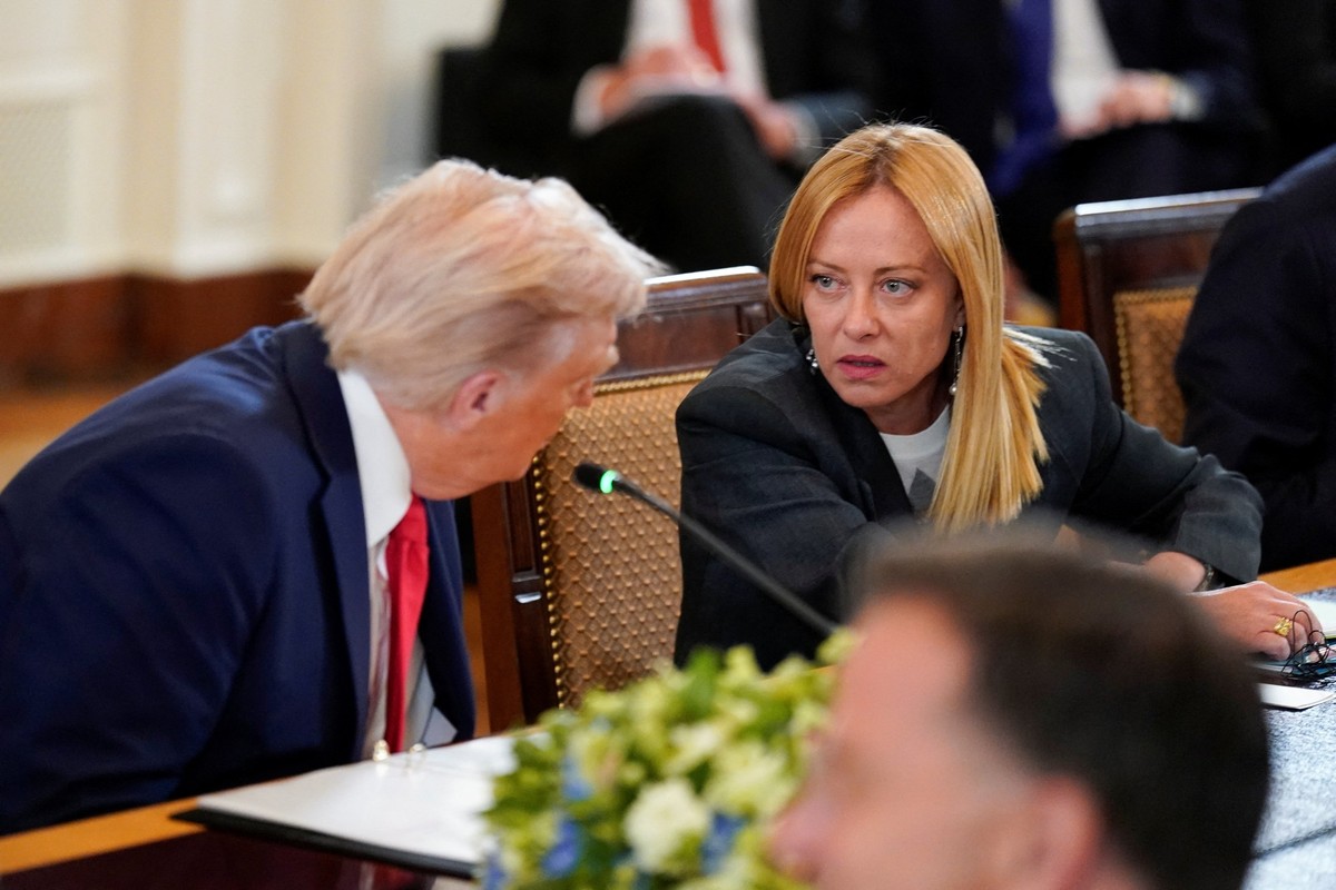 U.S. President Donald Trump speaks with Italian Prime Minister Giorgia Meloni during a meeting amid negotiations to end the Russian war in Ukraine, at the White House in Washington, D.C., U.S., August ...