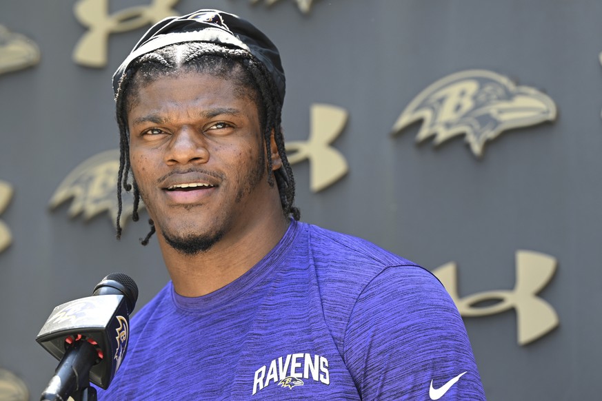 FILE - Baltimore Ravens quarterback Lamar Jackson answers questions from the media before a mandatory NFL football mini camp Wednesday, June 14, 2023, in Owings Mills, Md. Lamar Jackson is back with t ...