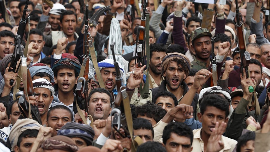epa10544394 Houthi supporters shout slogans during a protest marking the eighth anniversary of the Saudi-led military campaign on Yemen, in Sana&#039;a, Yemen, 26 March 2023. Thousands of Houthi suppo ...