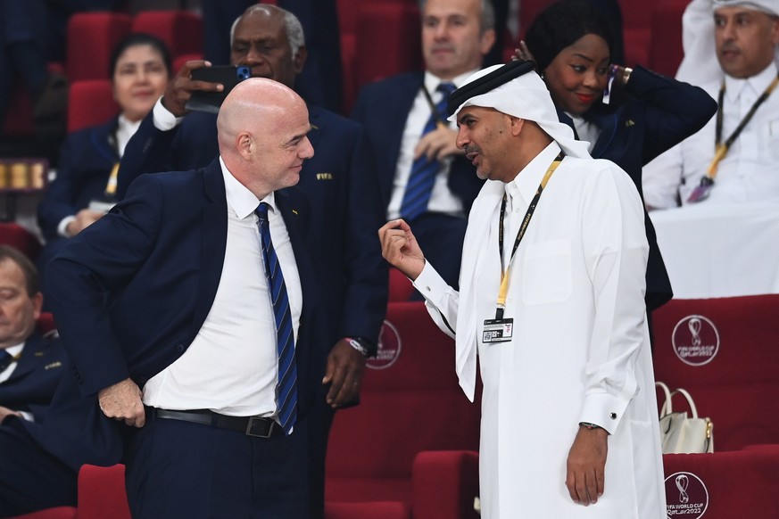 epa10370229 Qatari Prime Minister Khalid bin Khalifa bin Abdulaziz Al Thani talks with FIFA President Gianni Infantino (L) ahead of the FIFA World Cup 2022 third place soccer match between Croatia and ...