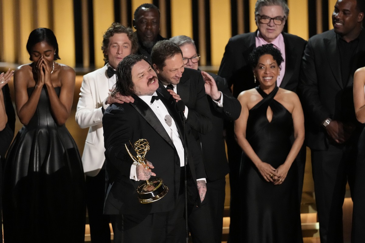 Matty Matheson, center, and the team from "The Bear" accept the award for outstanding comedy series during the 75th Primetime Emmy Awards on Monday, Jan. 15, 2024, at the Peacock Theater in  ...
