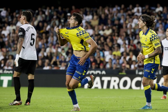 Valencia CF v UD Las Palmas - La Liga EA Sports Alex Munoz of UD Las Palmas celebrates after scoring the 1-1 goal with his teammate during the La Liga match between Valencia CF and UD Las Palmas at Me ...
