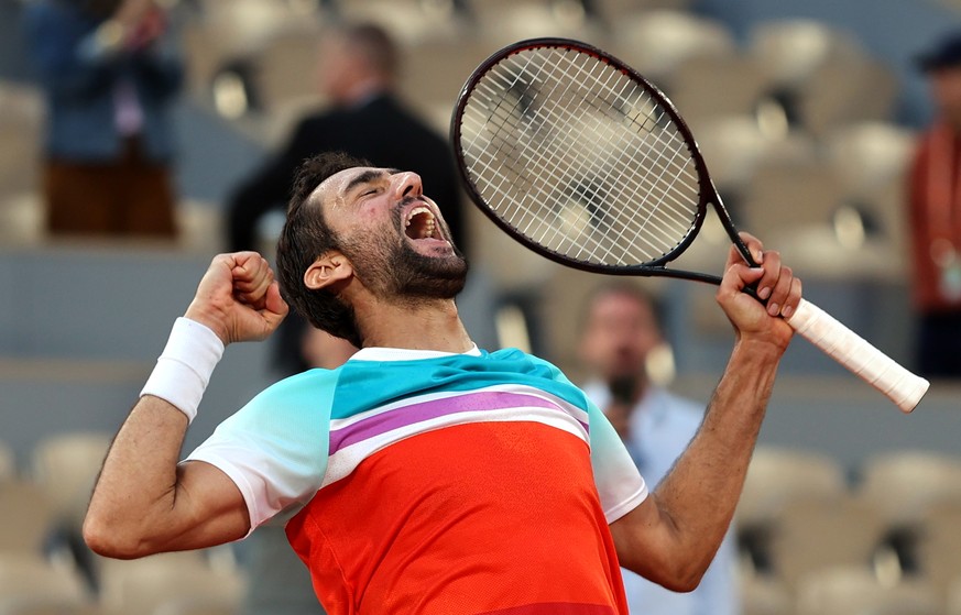 epa09990337 Marin Cilic of Croatia reacts after winning against Andrey Rublev of Russia in their men?s quarterfinal match during the French Open tennis tournament at Roland ?Garros in Paris, France, 0 ...