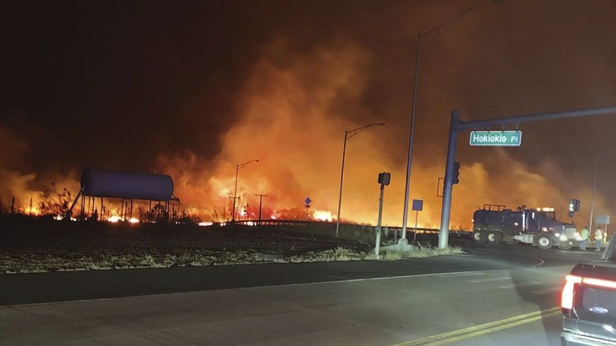 This photo provided by County of Maui shows fire and smoke filling the sky from wildfires on the intersection at Hokiokio Place and Lahaina Bypass in Maui, Hawaii on Tuesday, Aug. 8, 2023. Wildfires i ...