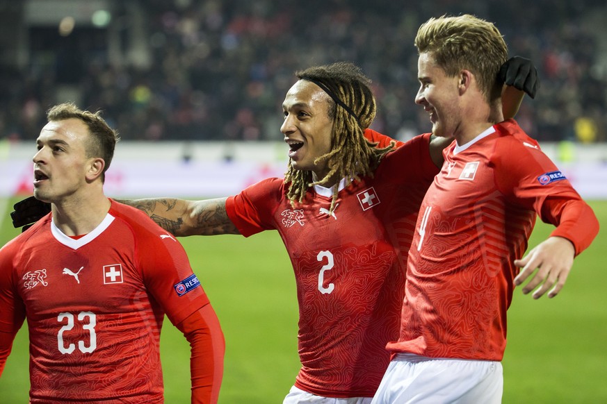 Switzerland&#039;s Xherdan Shaqiri, Switzerland&#039;s Kevin Mbabu and Switzerland&#039;s Nico Elvedi, from left, celebrate during the UEFA Nations League soccer match between Switzerland and Belgium  ...