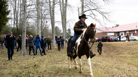 Republican Senate nominee Roy Moore rides away on a horse after casting his ballot in Alabama&#039;s special Senate election, Tuesday, Dec. 12, 2017, in Gallant, Ala. (Albert Cesare/The Montgomery Adv ...