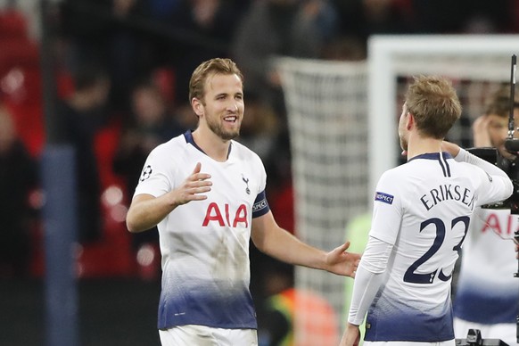 Tottenham midfielder Christian Eriksen salutes his teammate Harry Kane after the end of the Champions League Group B soccer match between Tottenham Hotspur and PSV Eindhoven at Wembley Stadium in Lond ...