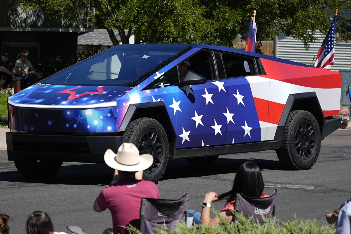 A Tesla Cybertruck wrapped in a patriotic motif takes part in the Colorado 4th at Firestone parade to mark the Independence Day holiday Thursday, July 4, 2024, in Firestone, Colo. Floats, marching ban ...