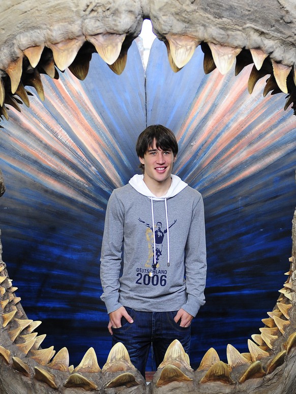 FC Barcelona&#039;s player Bojan Krkic from Spain, poses inside a prehistoric shark&#039;s jaw at the Aquarium of Barcelona before he dived underwater in Barcelona, Spain, Wednesday, Dec. 23, 2009. (A ...