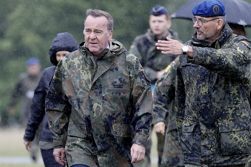 epa10779407 German Defense Minister Boris Pistorius (C-L) during his visit at the Bundeswehr medical service to attend a demonstration of their operational medicine skills, in Ulm, Germany, 01 August  ...