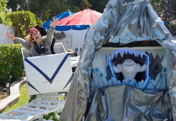 Mandy AcArthur rides the Madderhorn (cq) rollercoaster in her father&#039;s Fullerton backyard on June 1, 2016. 

Steve Dobbs, a former Boeing aerospace engineer, built Disney-inspired rides in his ba ...