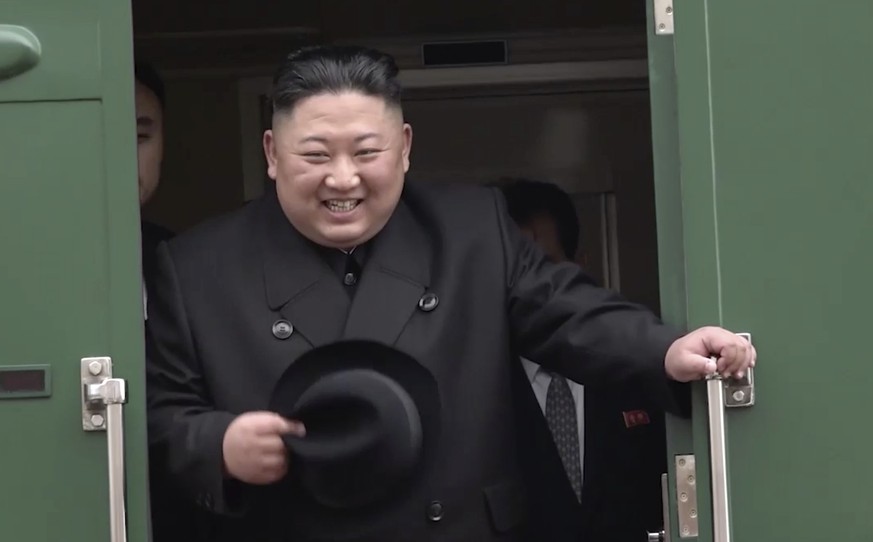 In this image from video released by Primorsky Regional Administration Press Service, North Korean leader Kim Jong Un smiles as he leaves Khasan train station in Primorye region, Russia, Wednesday, Ap ...