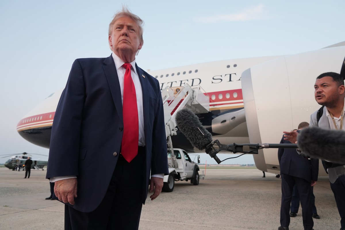 President Donald Trump speaks to reporters as he exits Air Force One at Joint Base Andrews, Md., after attending the World Cup final soccer match, Sunday, July 19, 2026. (AP Photo/Jacquelyn Martin)
Do ...