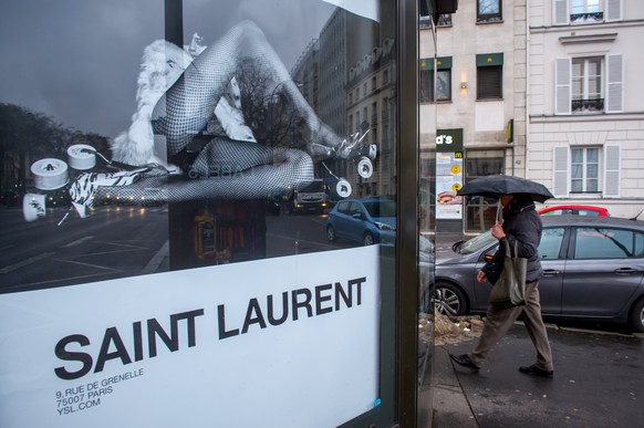 epa05836862 View of an advertisement poster of French luxury brand Saint Laurent shows a woman with spread legs in fishnet stockings in Neuilly, near Paris, France, 08 March 2017. The advertisement tr ...