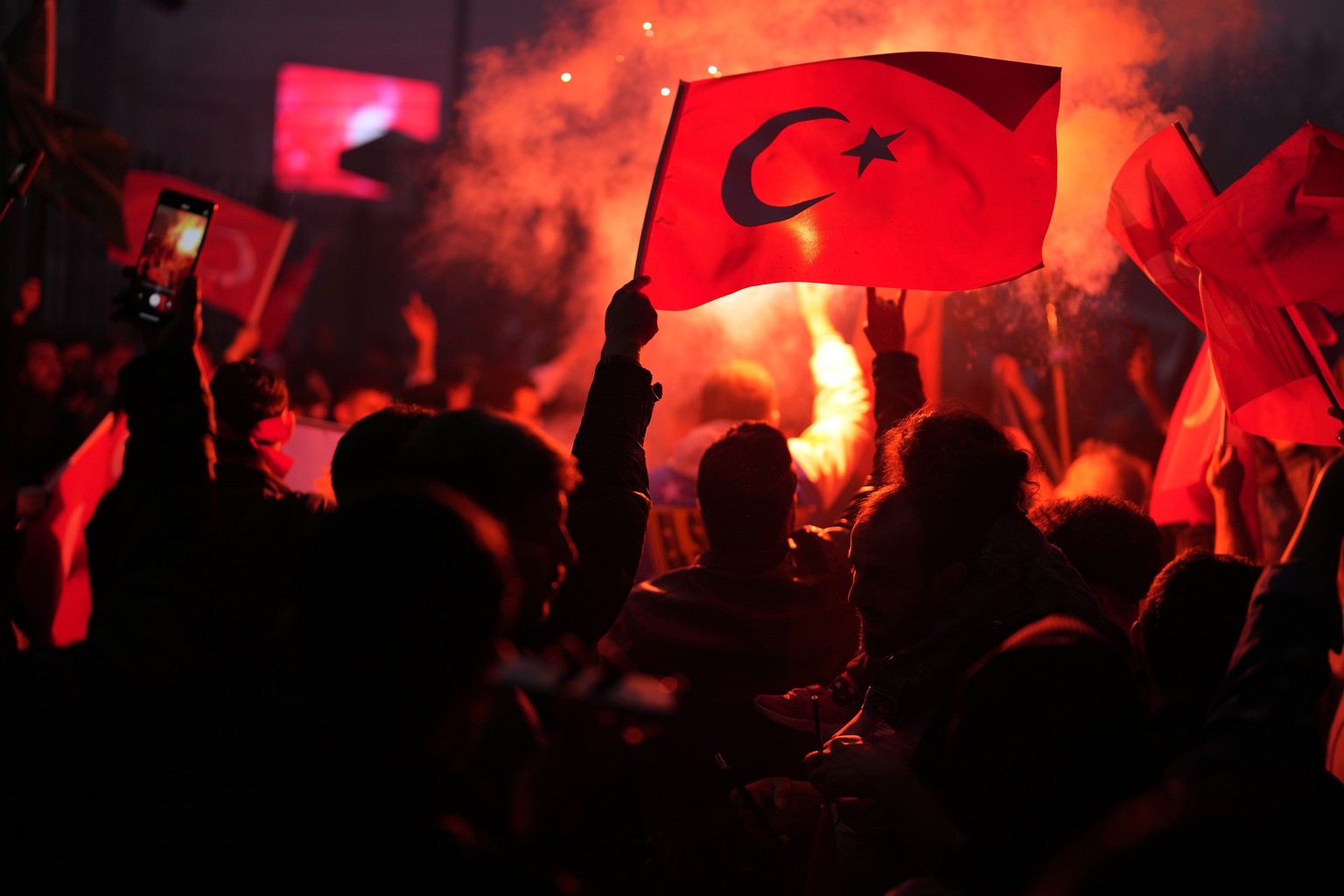 Supporters of the President Recep Tayyip Erdogan celebrate outside AK Party offices in Istanbul, Turkey, Sunday, May 28, 2023. Turkey&#039;s incumbent President Recep Tayyip Erdogan has declared victo ...