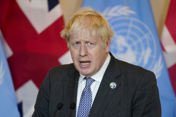 FILE - In this Monday, Sept. 20, 2021 file photo, British Prime Minister Boris Johnson speaks to reporters at United Nations headquarters. Johnson will on Tuesday, Sept. 28 finally meet with members o ...