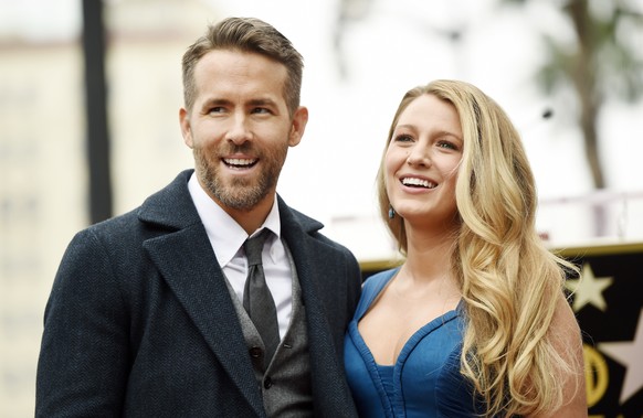 Actor Ryan Reynolds, left, and his wife, actress Blake Lively, pose together following a ceremony to award him a star on the Hollywood Walk of Fame on Thursday, Dec. 15, 2016, in Los Angeles. (Photo b ...