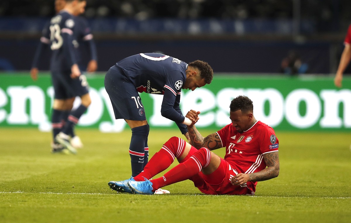 PSG's Neymar and Bayern's Jerome Boateng during the Champions League, second leg, quarterfinal soccer match between Paris Saint Germain and Bayern Munich at the Parc des Princes stadium, in  ...