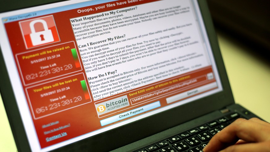 epa05960674 A programer shows a sample of a ransomware cyberattack on a laptop in Taipei, Taiwan, 13 May, 2017. According to news reports, a &#039;WannaCry&#039; ransomware cyber attack hits thousands ...