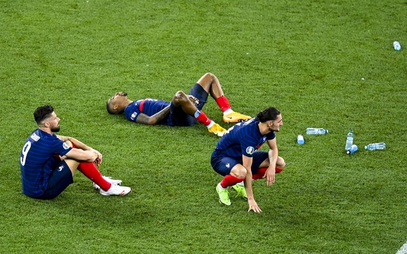 French players react following their loss to Switzerland in a penalty shoot out during the Euro 2020 soccer championship round of 16 match at National Arena stadium, Bucharest, Romania, Tuesday, June  ...