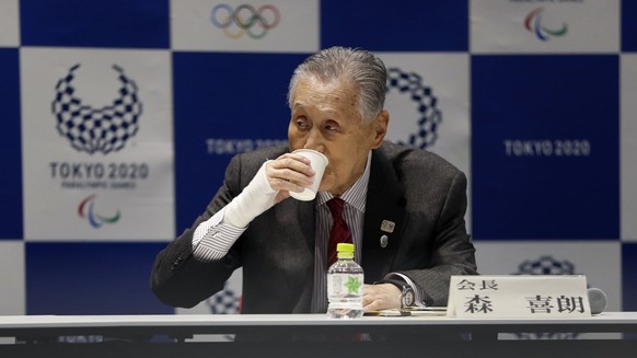 Tokyo 2020 Organizing Committee President Yoshiro Mori drinks a cup of water during the Tokyo 2020 Executive Board Meeting in Tokyo, Japan Monday, March 30, 2020. Mori said Monday he expects to talk w ...