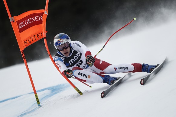 Switzerland&#039;s Marco Odermatt speeds down the course during an alpine ski, World Cup men&#039;s downhill in Kvitfjell, Norway, Saturday, March 5, 2022. (AP Photo/Gabriele Facciotti)