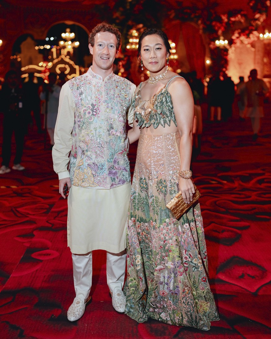 This photo released by the Reliance group shows Mark Zuckerberg and his wife Priscilla Chan posing for a photo during a pre-wedding function of Mukesh Ambani's son Anant Ambani in Jamnagar, Indiana...
