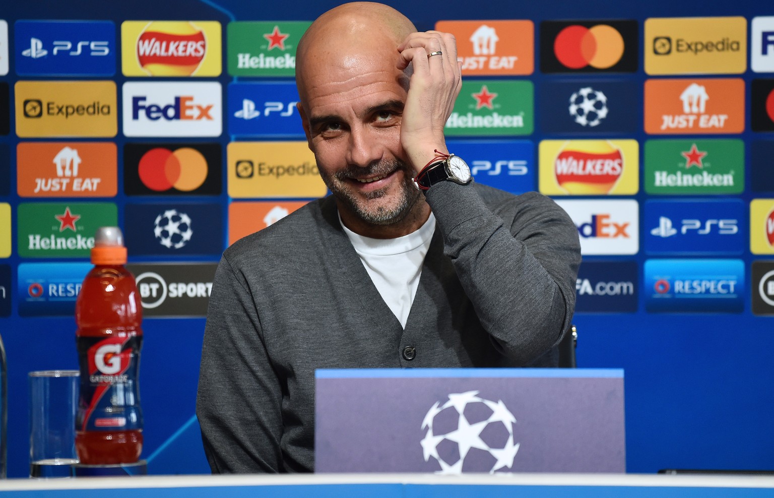 epa09908252 Manchester City manager Pep Guardiola reacts during a press conference in the City Football Academy in Manchester, Britain, 25 April 2022. Manchester City will face Real Madrid in their UE ...