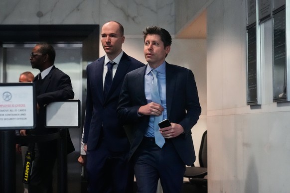 Sam Altman, right, and OpenAI president Greg Brockman, center, arrive at the U.S. District Court in Oakland, Calif., Thursday, April 30, 2026. (AP Photo/Godofredo A. Vásquez)
Sam Altman,Greg Brockman