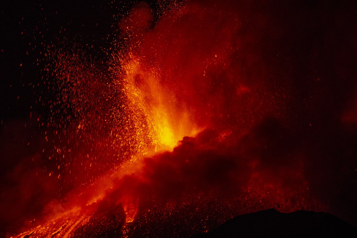 Lava erupts from a crater of Mt. Etna, Europe's largest active volcano, near Catania, in southern Italian island of Sicily, late Thursday, June 17, 2021. Since Feb. 16, 2021, Mt. Etna has begun a ...