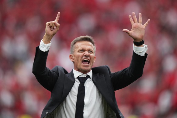 Canada head coach Jesse Marsch holds up six fingers as he celebrates after the World Cup Group B soccer match between Canada and Qatar in Vancouver, British Columbia, Thursday, June 18, 2026. (Darryl  ...