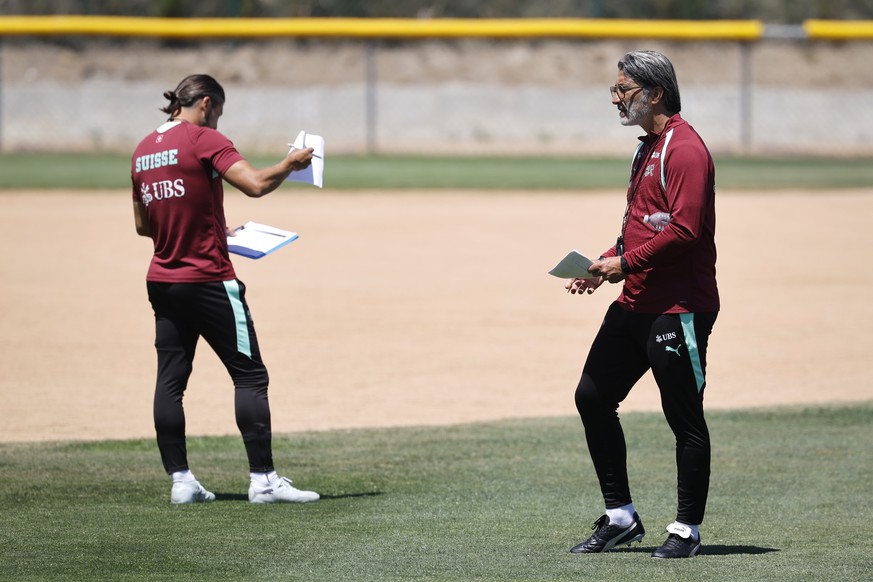 Switzerland's head coach Murat Yakin, right, and assistant coach Davide Calla make notes during a training session of the Swiss national soccer team at the SDJA in San Diego, California, USA, Mon ...