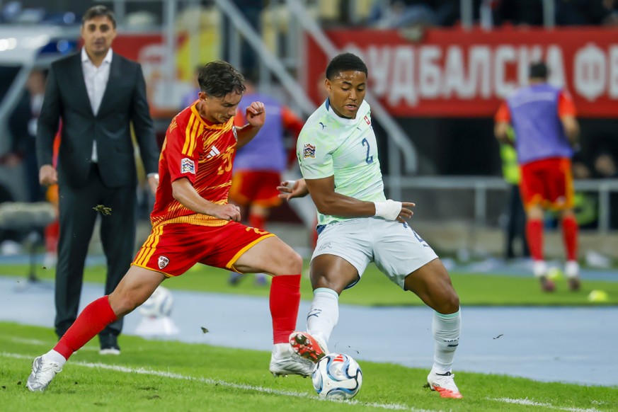 North Macedonia's Dimitar Mitrovski, left, fights for the ball with Switzerland's Sascha Britschgi, right, during the UEFA Nations League soccer match between North Macedonia and Switzerland ...