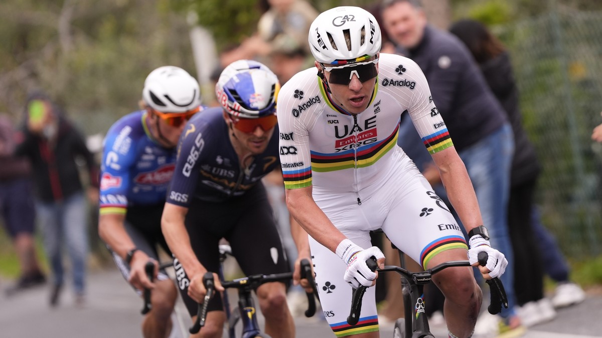 Slovenia's Tadej Pogacar of UAE Team Emirates XRG, leads ahead of Britain's Thomas Pidcock of Pinarello-Q36.5 Pro Cycling Team and Dutch cyclist Mathieu Van Der Poel of Alpecin-Premier Tech  ...