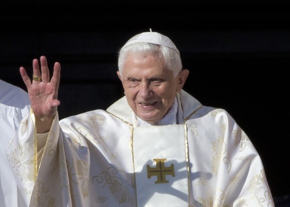 FILE - Pope Emeritus Benedict XVI arrives in St. Peter&#039;s Square at the Vatican to attend the beatification ceremony of Pope Paul VI, on Oct. 19, 2014. Pope Francis on Wednesday, Dec. 28, 2022, sa ...