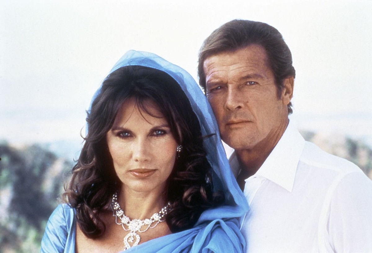 Actor Roger Moore and actress Maud Adams on the set of "Octopussy". (Photo by Sunset Boulevard/Corbis via Getty Images)